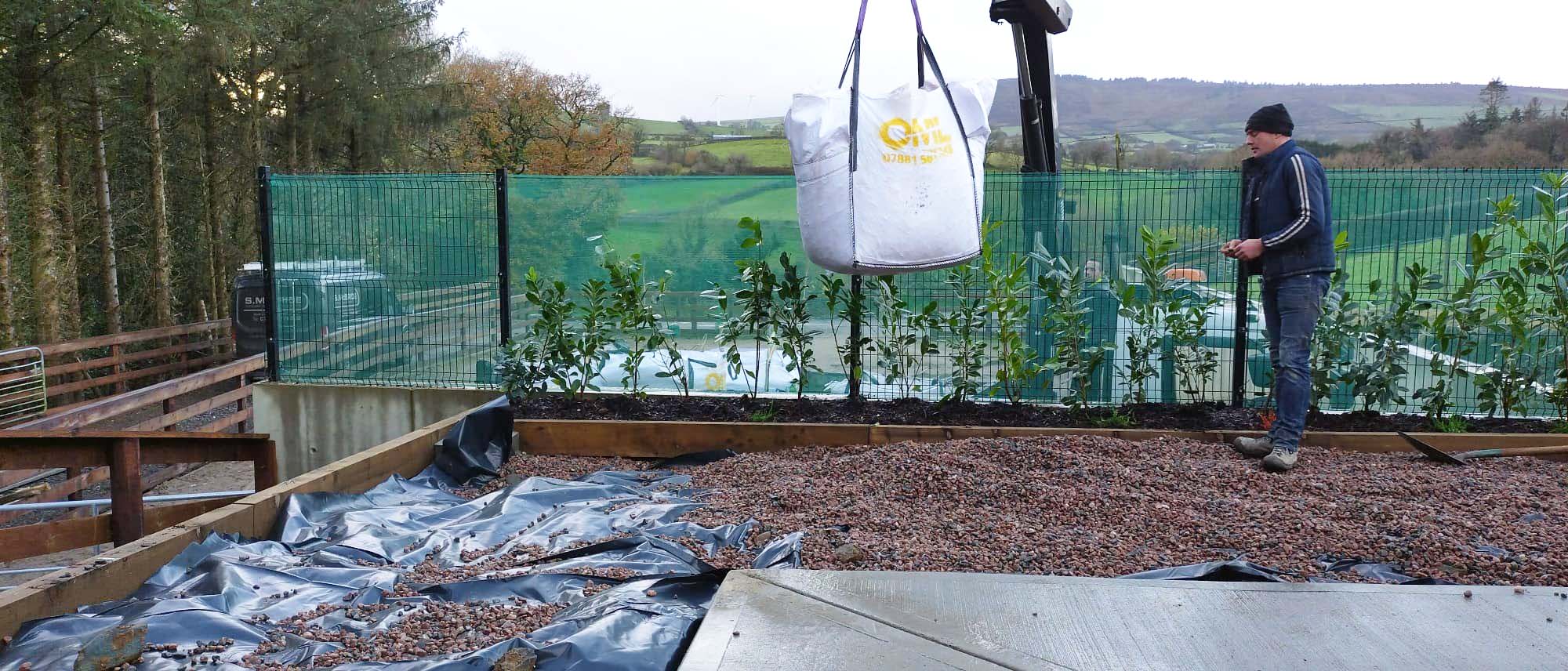 Gary placing bulk bag of stone in Omagh